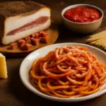 La vera ricetta dell’amatriciana romana: il tipo di guanciale che conquista tutti
